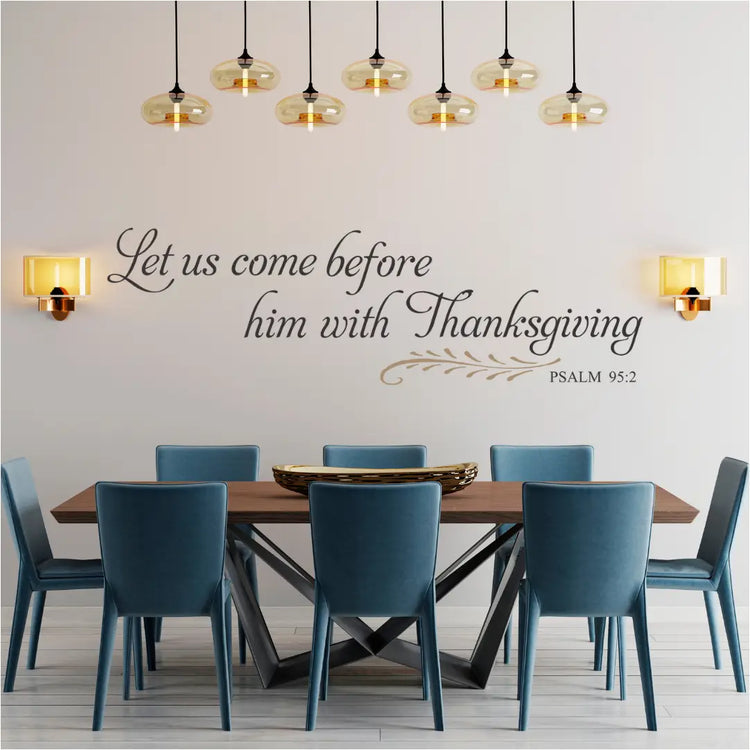 Dining room with wooden table and blue chairs, featuring a wall decal with a biblical quote of Psalm 95:2 perfect for Thanksgiving and/or dining room decor. 