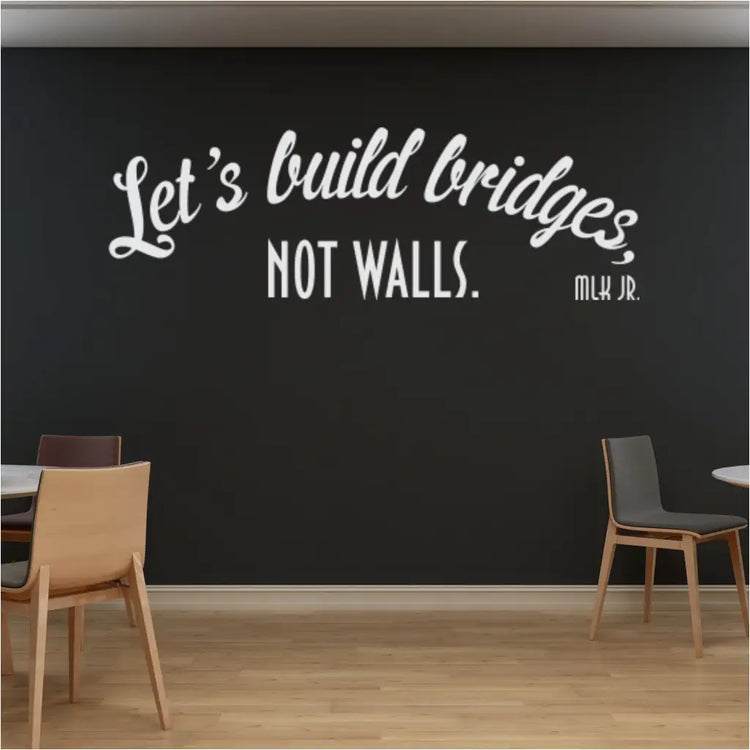 The "Let's build bridges not walls" decal placed prominently in a classroom, fostering a sense of community.