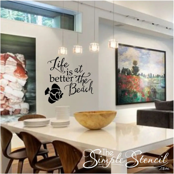 Life is better at the beach vinyl wall quote decal by The Simple Stencil shown in a beautiful home with tropical fish embellishment. 