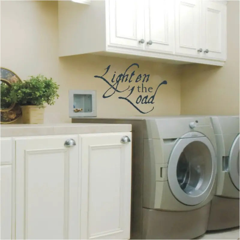 Lighten the Load vinyl wall decal displayed in laundry room over a washer and dryer.