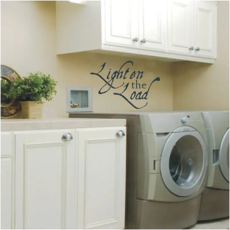 Lighten the Load vinyl wall decal displayed in laundry room over a washer and dryer.