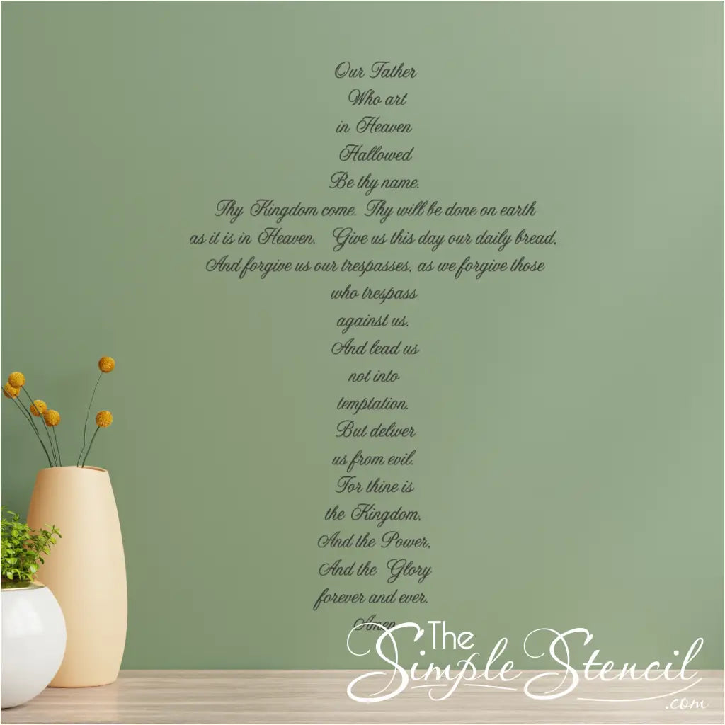 Cross-shaped Lord's Prayer wall decal displayed prominently on a living room wall. By The Simple Stencil