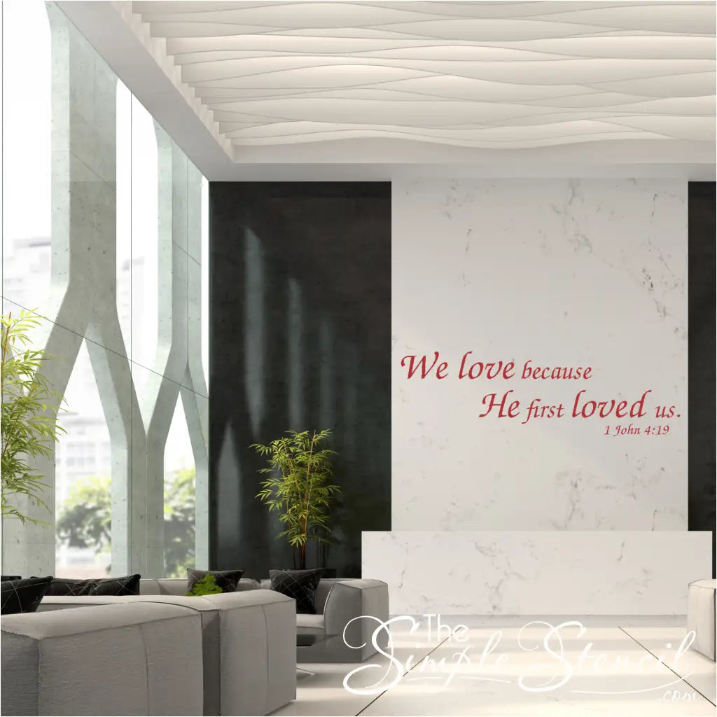 "We Love Because He First Loved Us" Bible Verse Wall Decal in a Church Lobby. Uplifting Christian decor for church gathering spaces.
