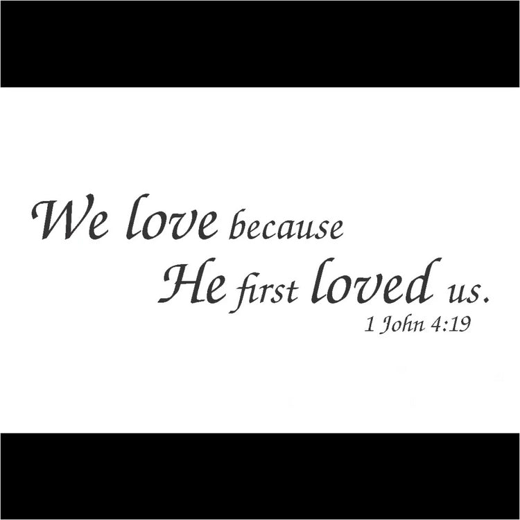 "We Love Because He First Loved Us" Bible Verse Wall Decal in Classic Script Font. Available in various sizes and colors.