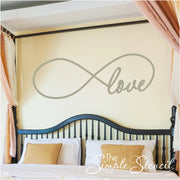 Customer supplied picture of our popular love infinity decal applied over her master bed to celebrate infinite love.
