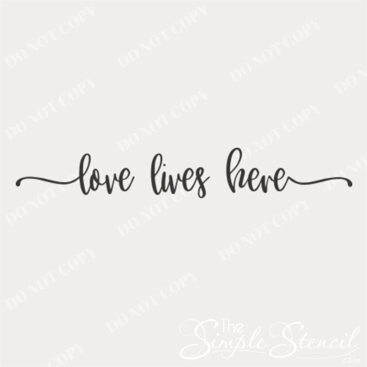 Close-up of 'Love Lives Here' flourish wall decal design 