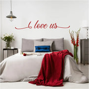 Beautifully scripted vinyl wall decal in a deep red color applied to a master bedroom wall over the bed adds a romantic touch to the beautiful room decor.
