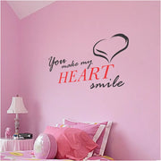You make my heart smile. A sweet vinyl wall decal that includes a heart embellishment looks cute on a girl's room wall. 
