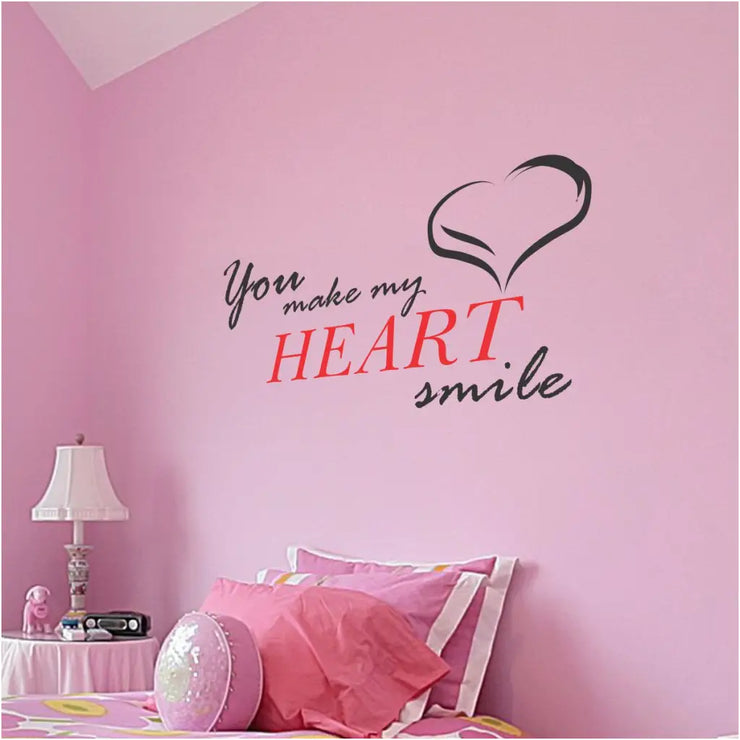 You make my heart smile. A sweet vinyl wall decal that includes a heart embellishment looks cute on a girl&