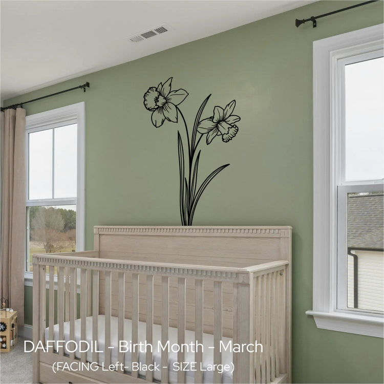 Black Daffodil line art wall graphic centered over a natural wood crib in a sage green, nature-inspired nursery.