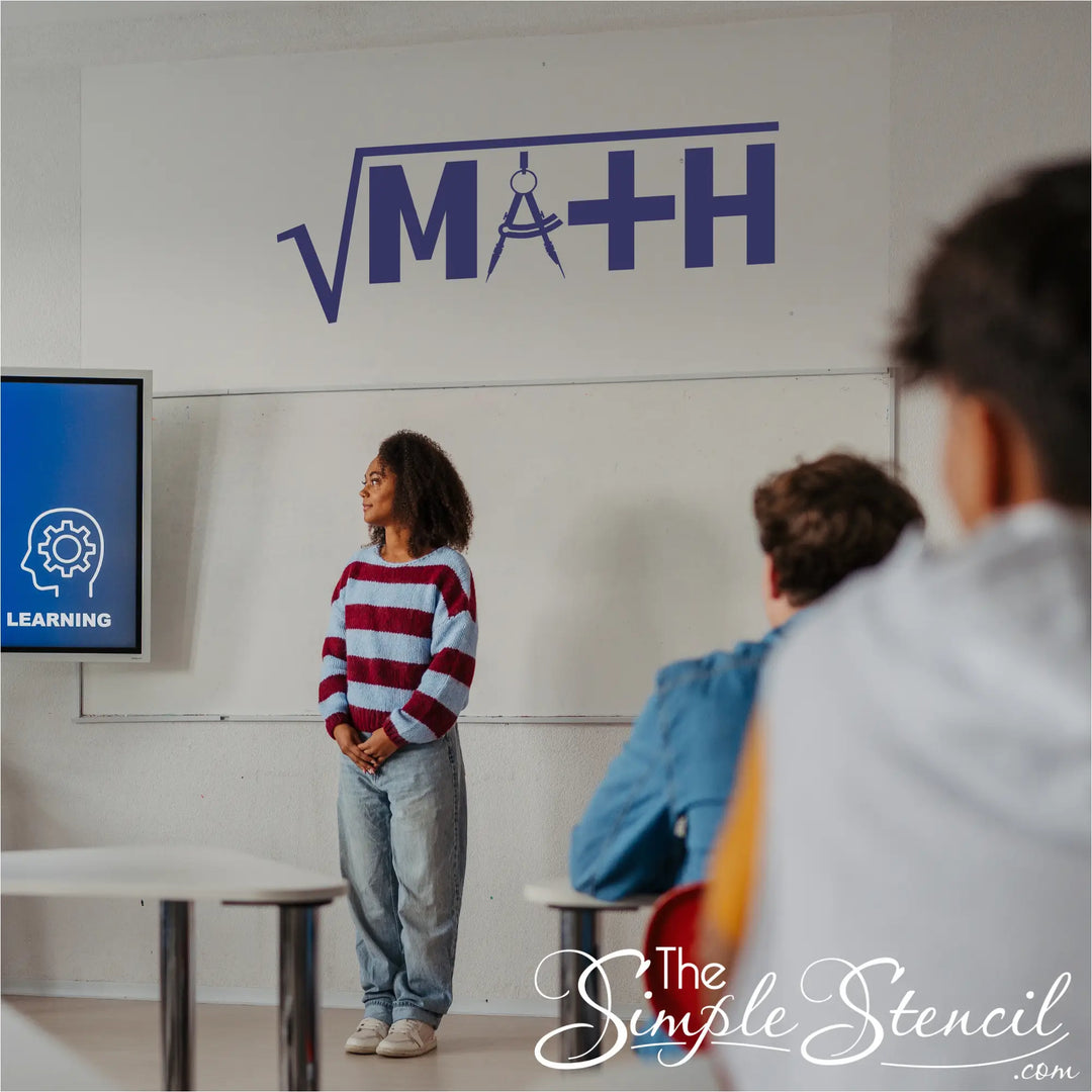 A blue MATH wall decal on a wall over a teacher teaching high school math to students
