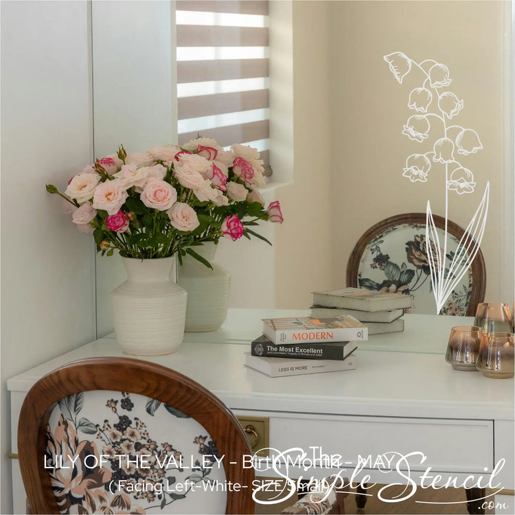 White Lily of the Valley botanical art applied to the corner of a vanity mirror, creating a custom hand-painted floral frame.