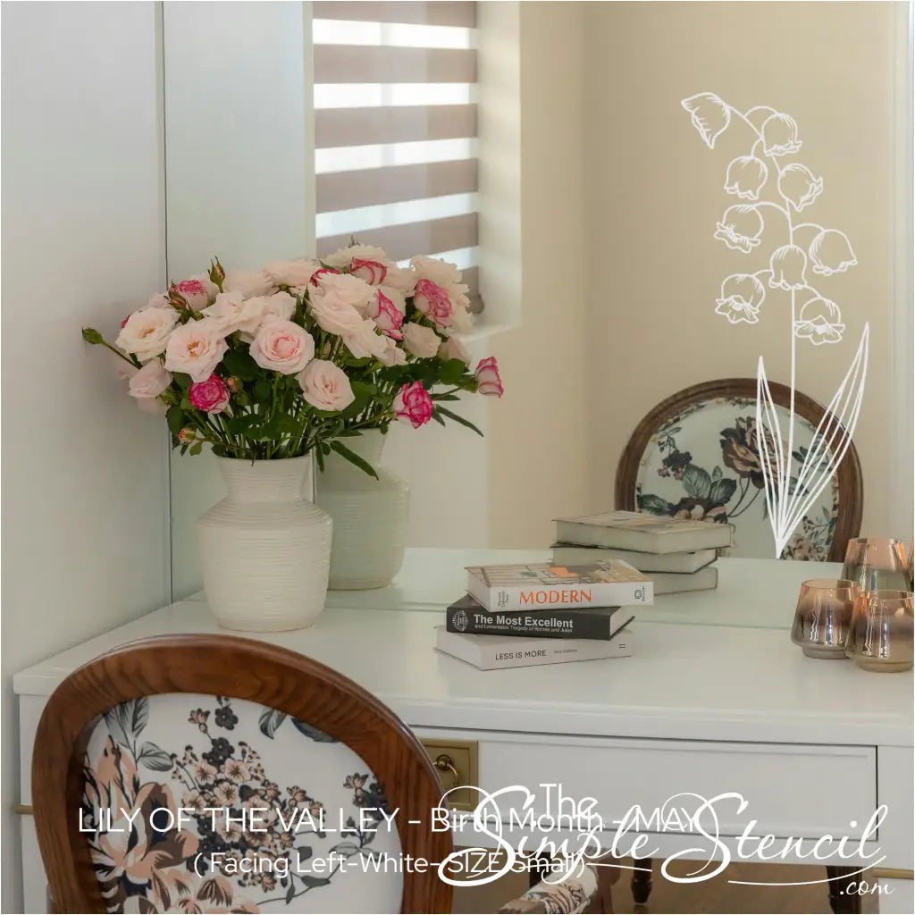 White Lily of the Valley botanical art applied to the corner of a vanity mirror, creating a custom hand-painted floral frame.