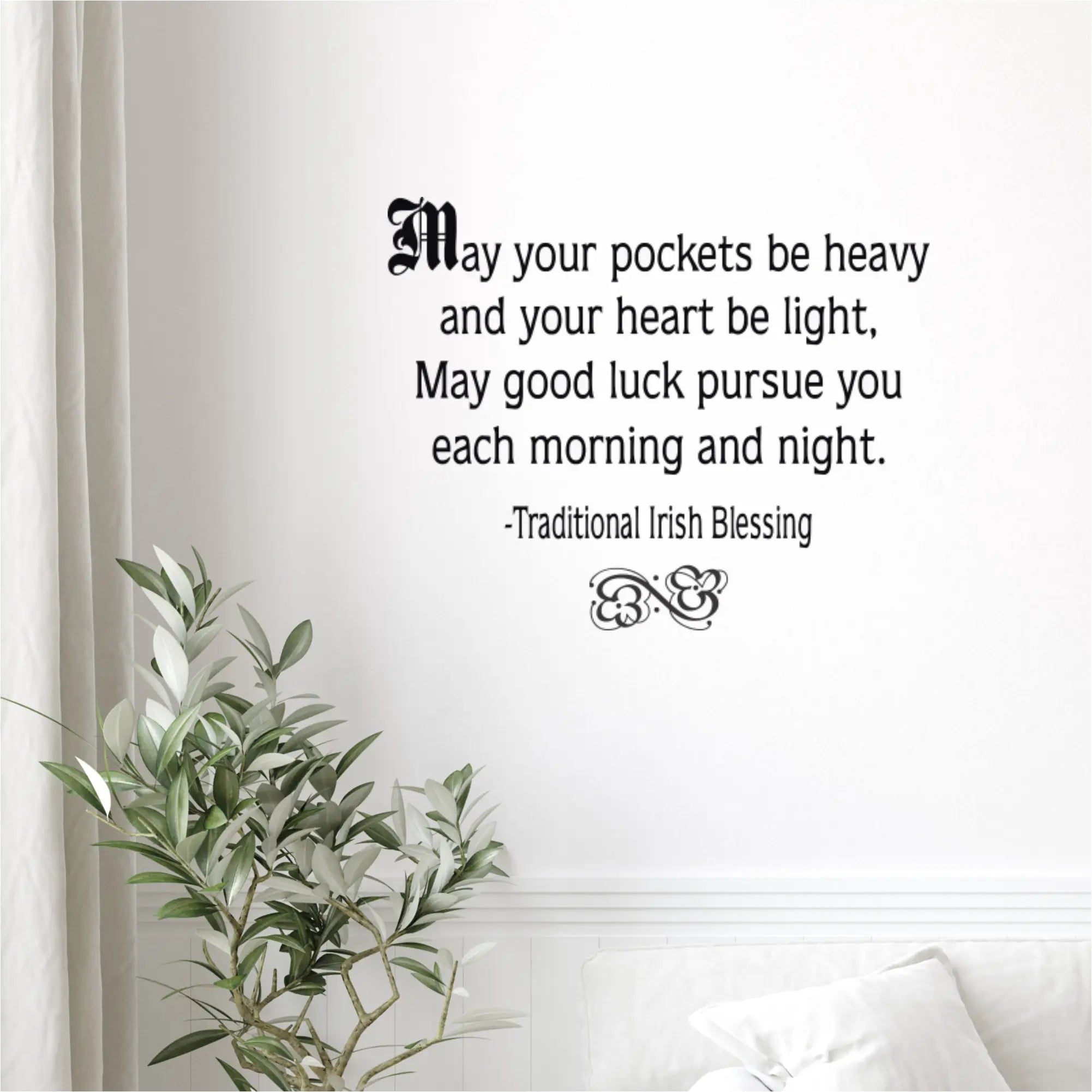 Traditional Irish blessing vinyl decal displayed on a bright white living room wall above a modern sofa, perfect for year-round inspiration or St. Patrick's Day decor.
