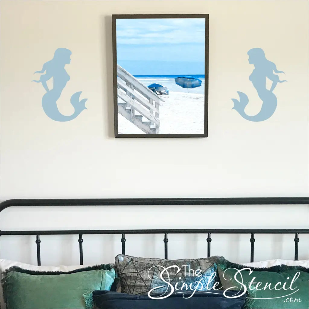 Mermaid silhouette wall decal on a bedroom wall.