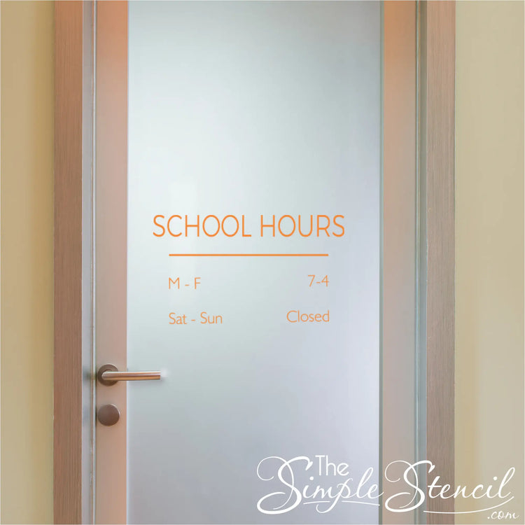 Small "SCHOOL HOURS" decal in bright colors on the door of a classroom.