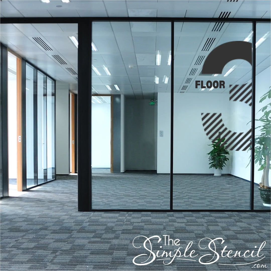 Professional 'FLOOR 3' navigation decal applied to a large glass office partition to assist visitors exiting an elevator.