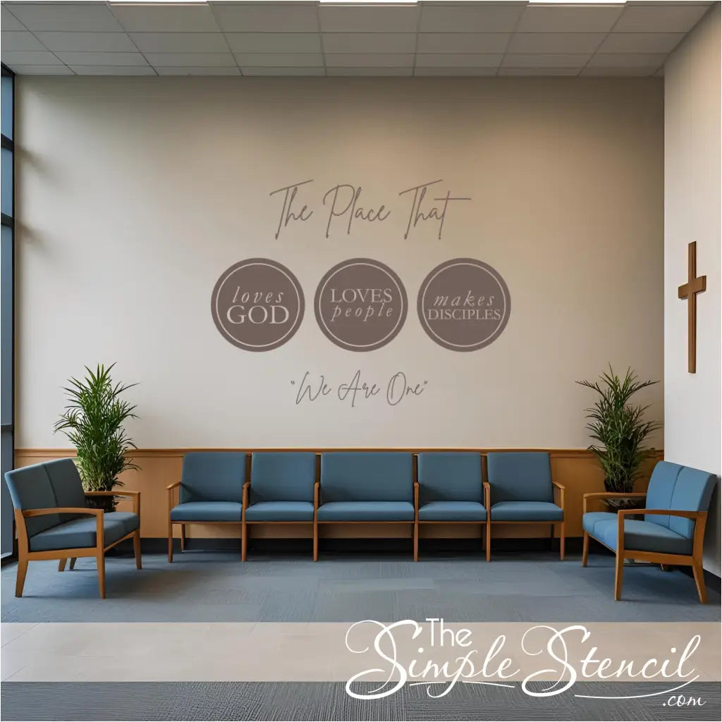 A welcoming church lobby enhanced by a large, impactful church wall decal reading "The place that loves God loves people Makes disciples We are one," a key element of the church wall decor.
