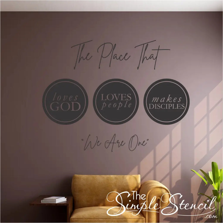 Inviting church entrance featuring a large-scale church wall decal that says "The place that loves God loves people Makes disciples We are one," contributing to the overall church wall decor.