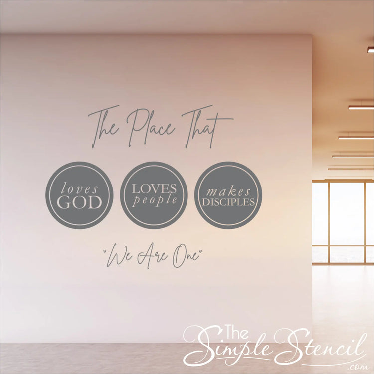 Here are 10 alt image descriptions for your wall decals, keeping SEO in mind for "Church wall decals," "church wall decor," and "church wall art," while describing the scene:

Modern church wall decal in a vibrant lobby, featuring the text "The place that loves God loves people Makes disciples We are one," enhancing the church wall decor.