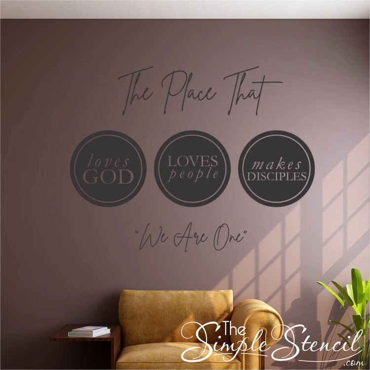 Inviting church entrance featuring a large-scale church wall decal that says "The place that loves God loves people Makes disciples We are one," contributing to the overall church wall decor.