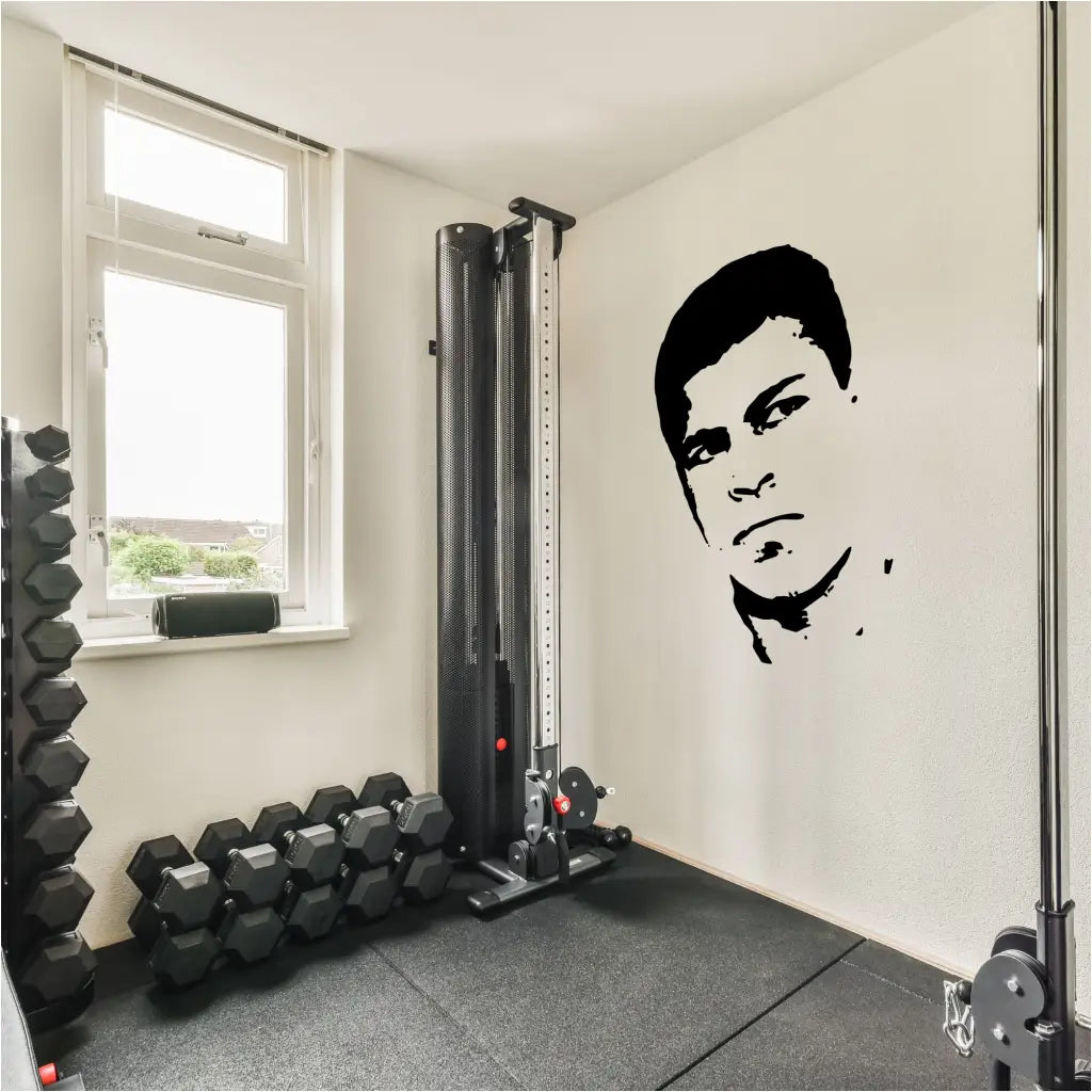 Muhammed Ali Silhouette Profile Wall Decal Mural  installed on a gym wall to inspire your workout. Many sizes and colors to choose from at The Simple Stencil