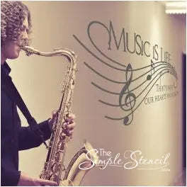 Music is life, that's why our hearts have beats vinyl wall decal displayed on a hallway outside of a school band room adds a fun element to the decor while students prepare or wait for class.