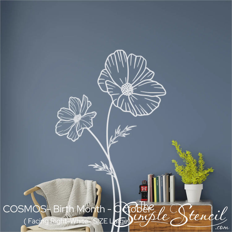 Large white Cosmos wall silhouette applied to a slate blue wall, showcasing the intricate line art and painted-on appearance.