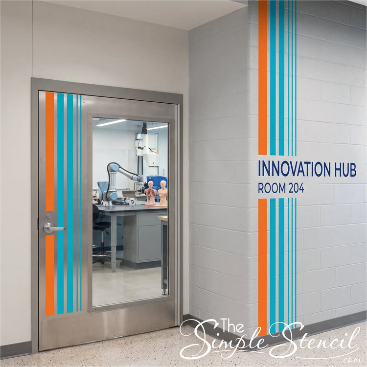 An interior hallway scene showing a stainless steel door with vertical teal and orange stripes, and a light gray brick wall with the text 'INNOVATION HUB ROOM 204' and matching orange and teal stripes that are easy to install using Simple Stencil peel and stick striping and custom decals. 