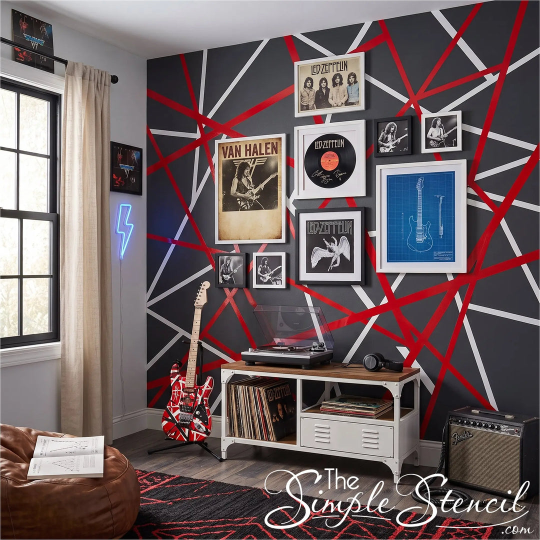 A styled music-themed room featuring a dark gray wall with a bold red and white geometric line pattern supplied by Simple Stencil.  Using peel and stick striping decals allowed this customer to replicate the eddie van halen guitar look in a teens room. 