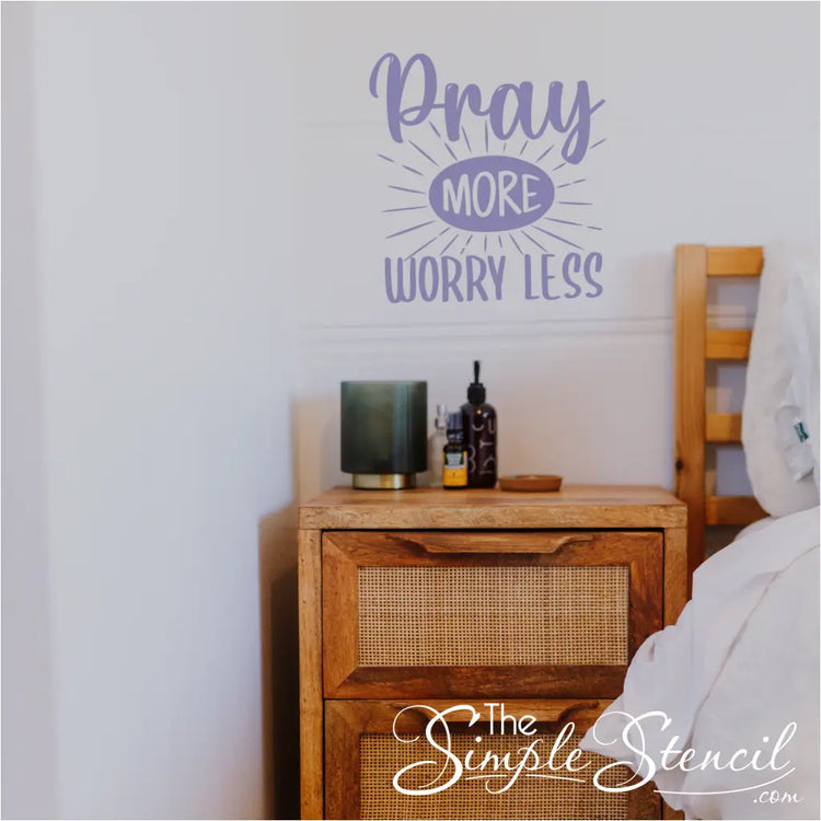 "Pray More Worry Less" decal applied to a bedroom wall