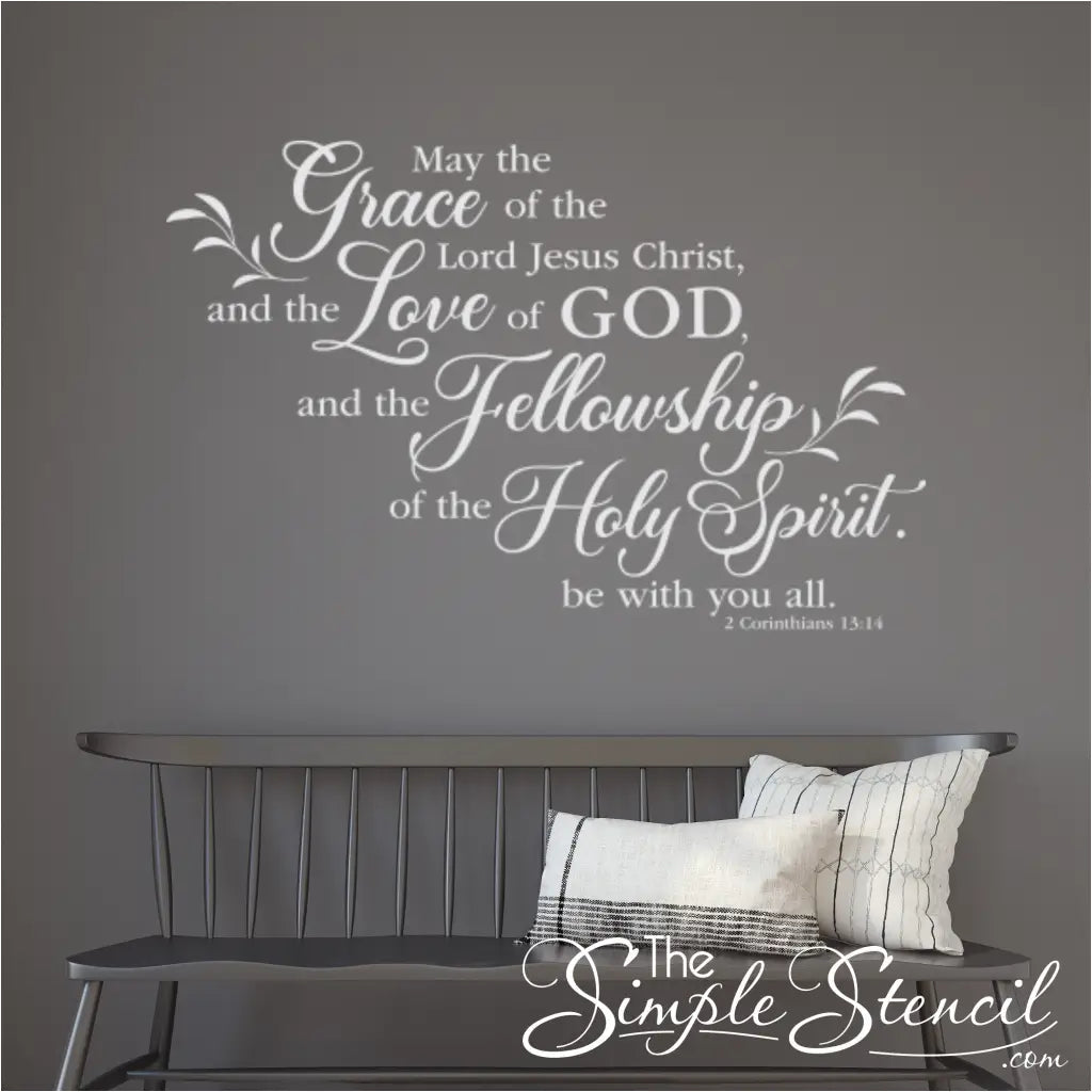 Large white 2 Corinthians 13:14 decal on a dark grey paneled wall above a bench, providing a sophisticated look for a church vestibule or youth area.