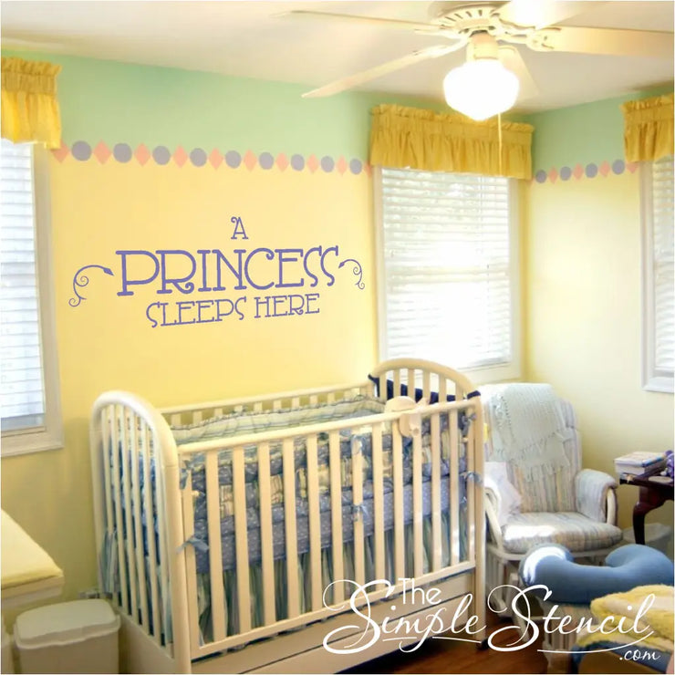 A princess sleeps here large vinyl wall decal in purple placed behind the crib on the wall in this cute baby nursery.