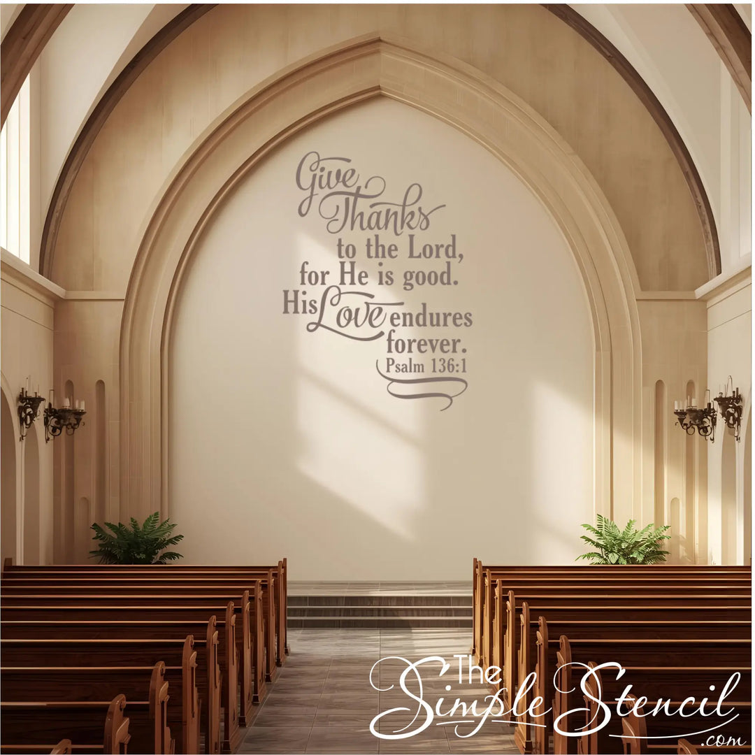 Church wall décor vinyl lettering of the Bible verse "Give thanks to the Lord" on a large, stone-colored arched wall above the altar/pulpit area.