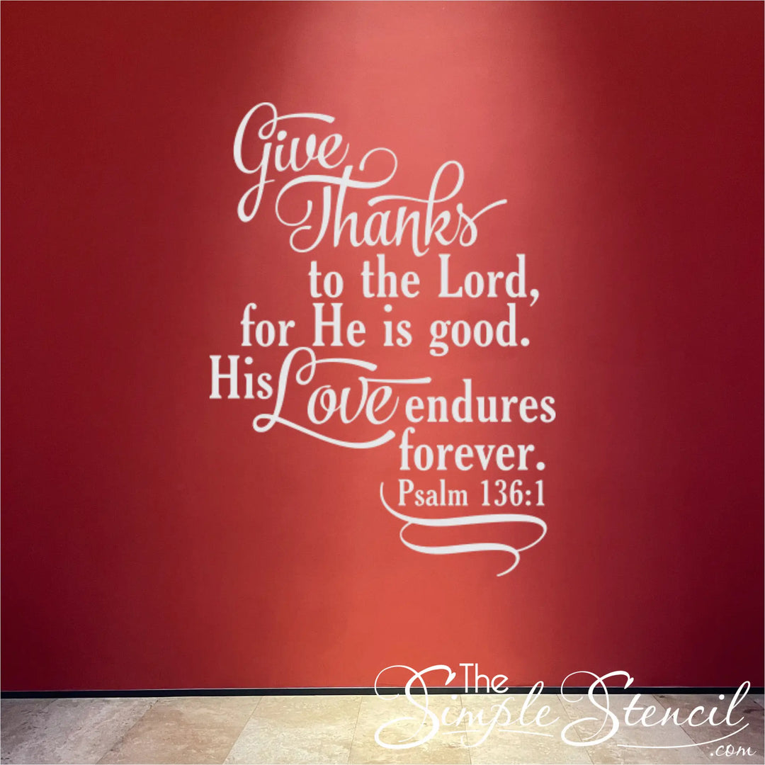 "His Love Endures Forever" decal in bright white, creating a powerful, high-contrast focal point on a vibrant red accent wall.