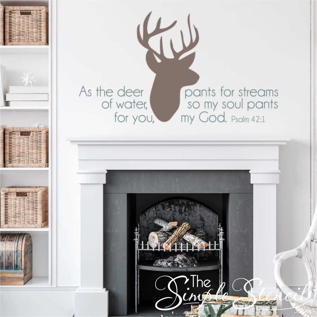 Taupe-colored Psalm 42:1 wall decal featuring a deer head silhouette and scripture, styled over a modern white fireplace mantel in a bright living room.