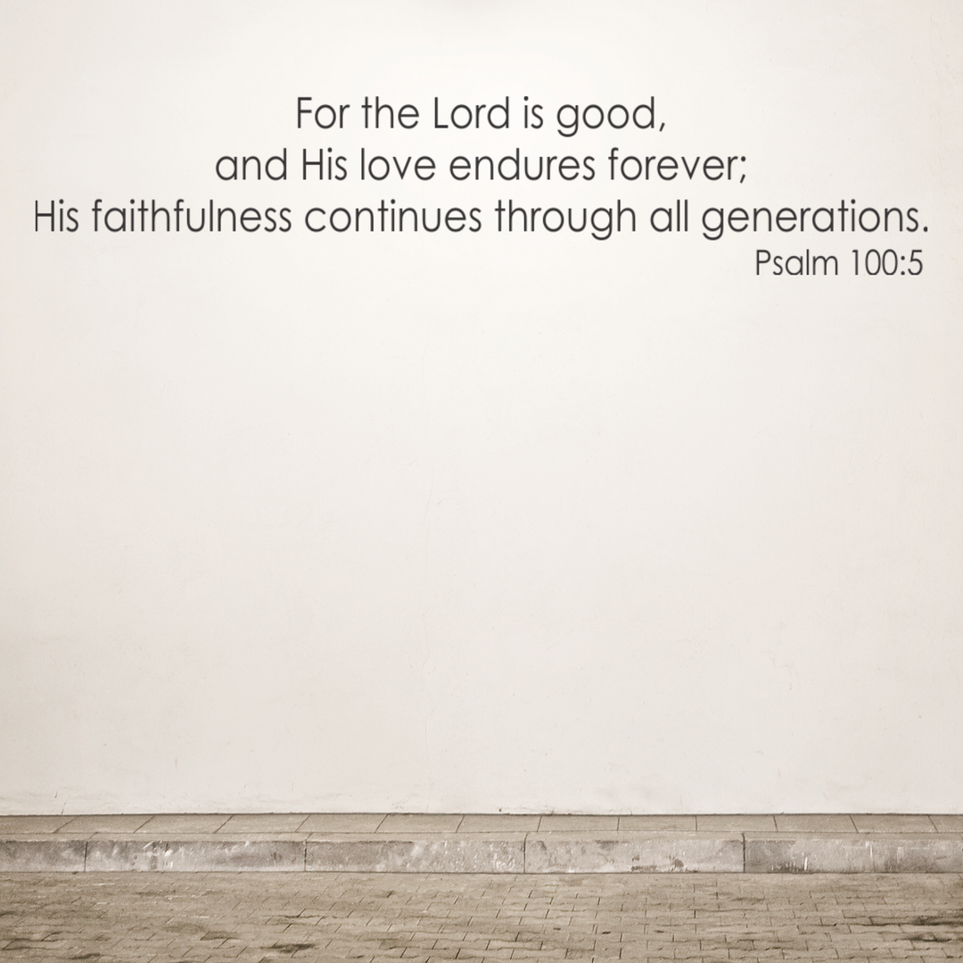 Bible verse on a plain wall with a wooden floor.