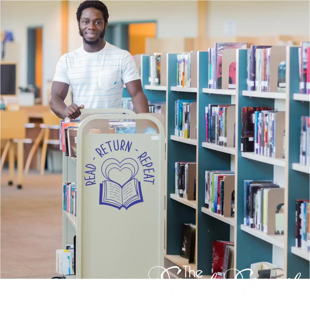 "Read Return Repeat" wall decal on a librarian's book return cart in a school library.