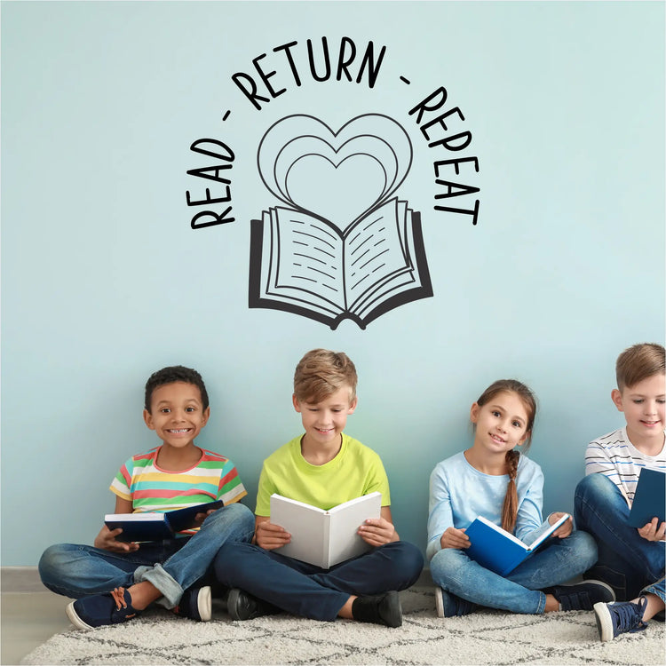 "Read Return Repeat" wall decal in black on a library wall, featuring an open book and heart graphics.