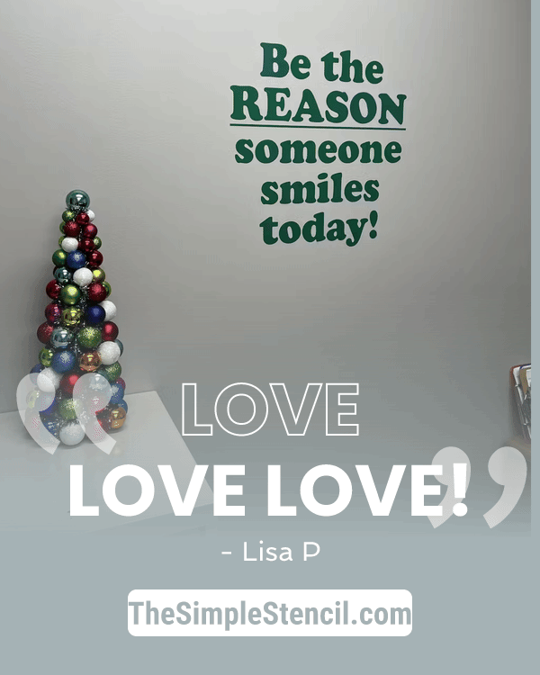A festive wall decal featuring a cone-shaped christmas tree with colorful reflective glass ornaments to inspire smiles today