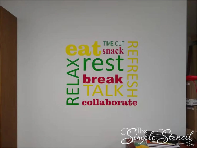 Colorful vinyl wall decal in a staff lounge or office break room with words like 'eat, rest, refresh, relax, break, talk, collaborate' in red, yellow, and green, promoting a relaxing atmosphere for staff and teachers. 