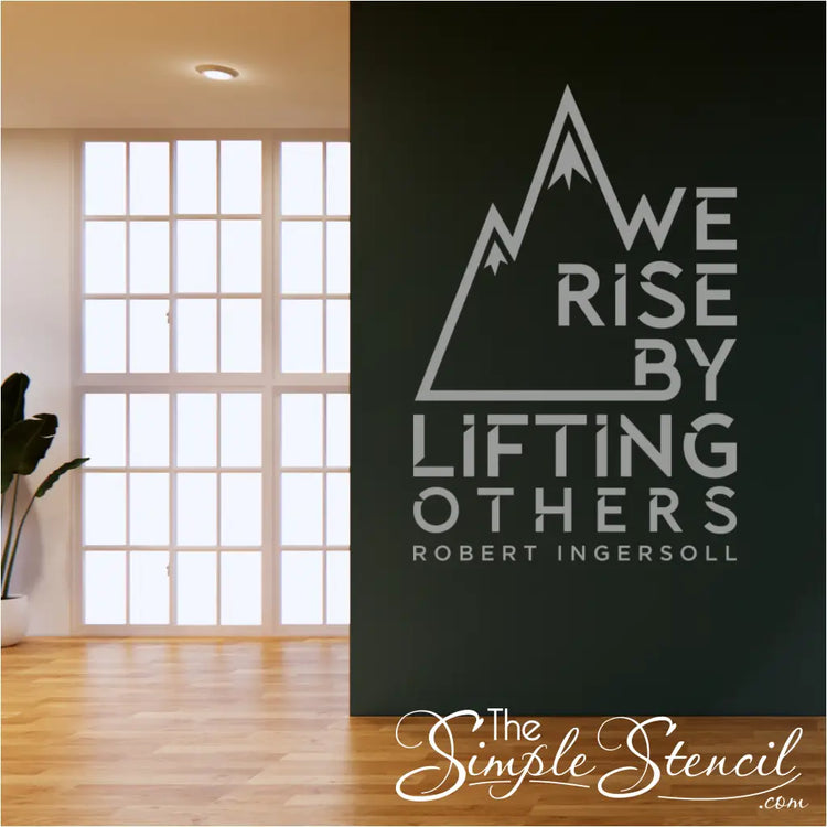 Modern wall decor with the quote "We rise by lifting others."