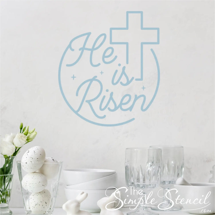 The "He is risen" wall decal with the cross graphic, promoting the message of Easter.