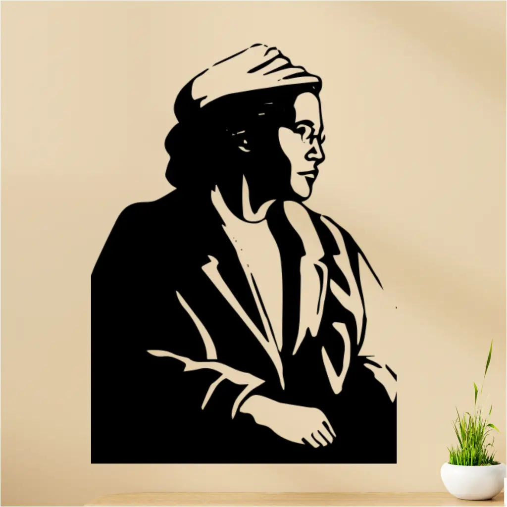 Inspiring wall decal featuring the profile of Rosa Parks installed on a wall over a desk in classroom setting