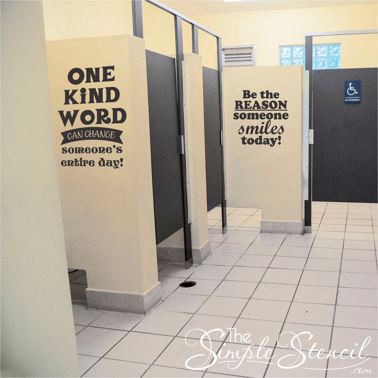 Two black and white kindness decals installed in a school bathroom to promote kindness and prevent bullying