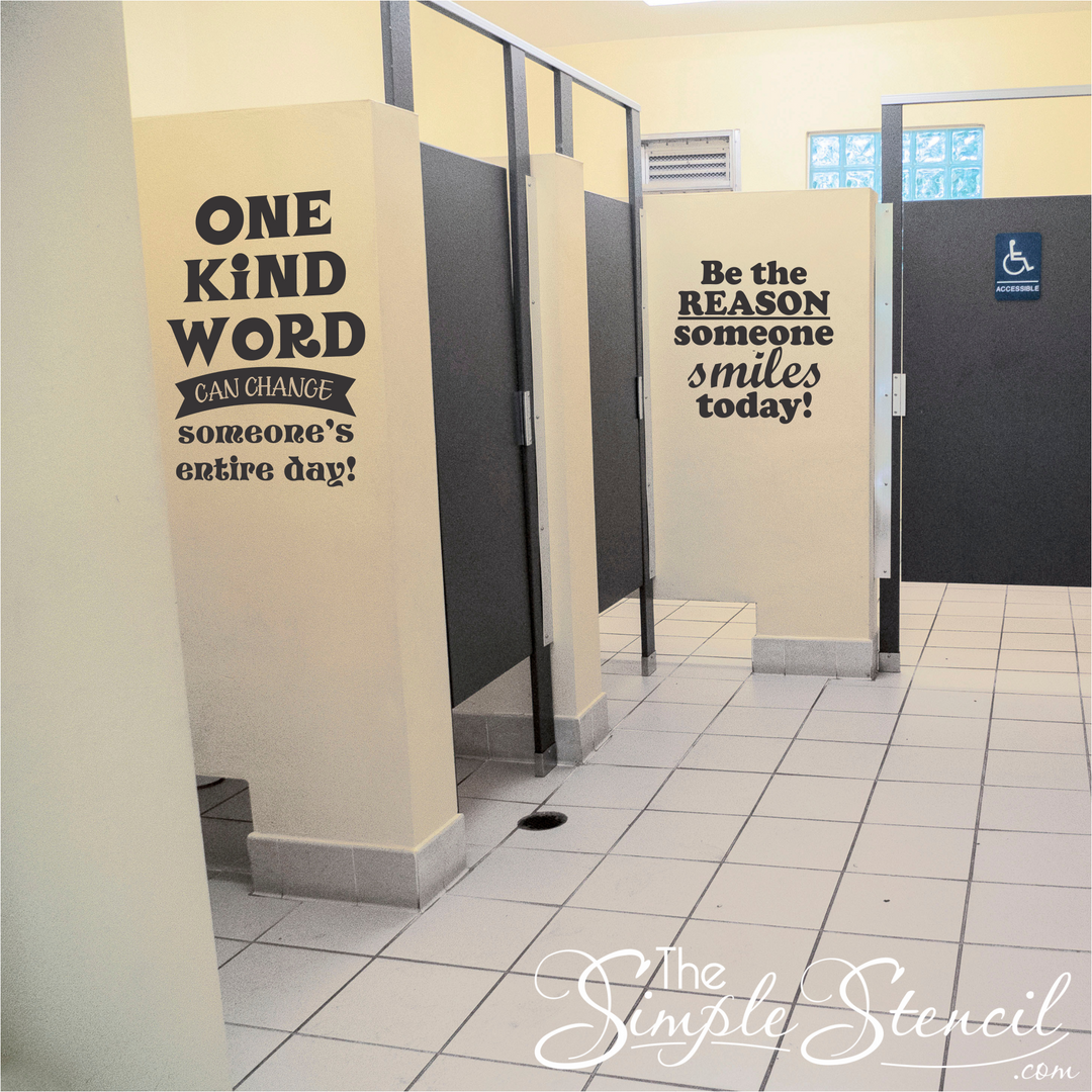 Two black and white kindness decals installed in a school bathroom to promote kindness and prevent bullying