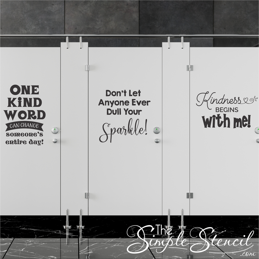 Colorful kindness quote decals on school bathroom stall doors with positive messages for students