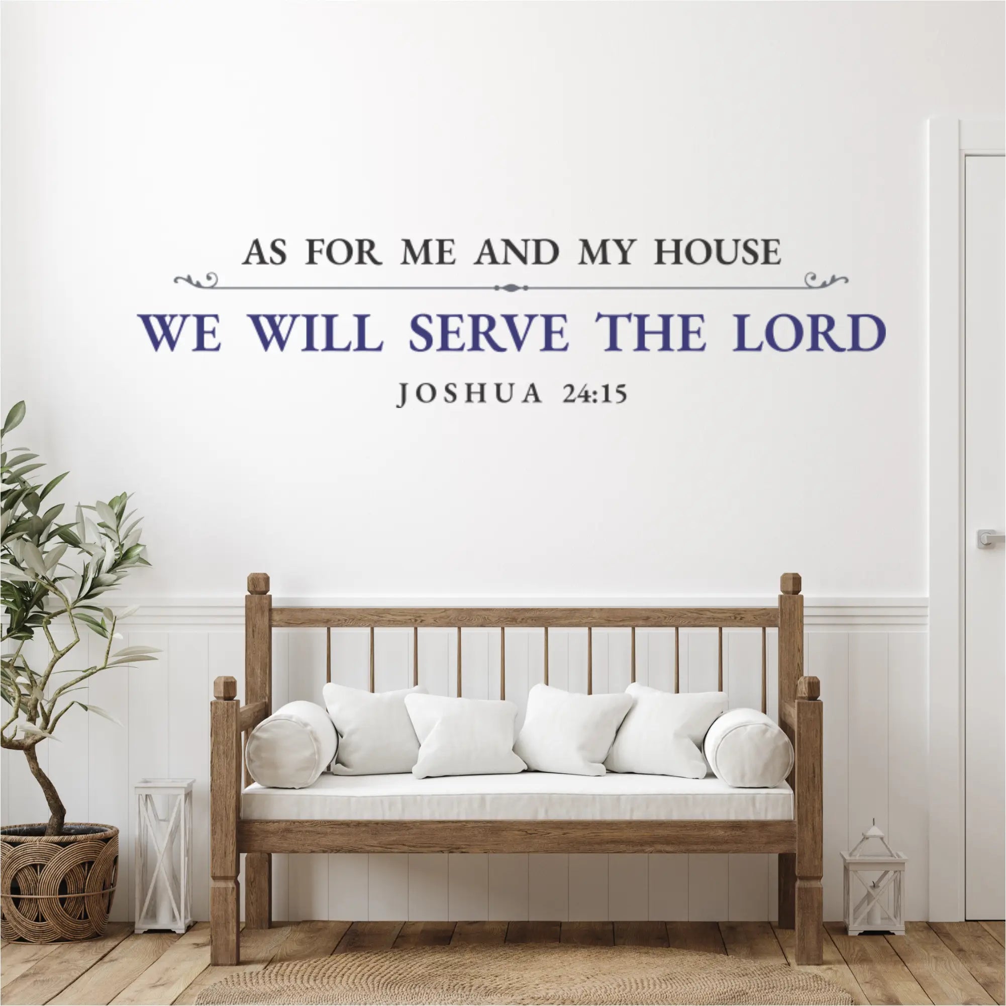 Dark blue Christian wall art decal, "As For Me and My House...", on a white shiplap wall above a rustic wooden bench with white pillows.
