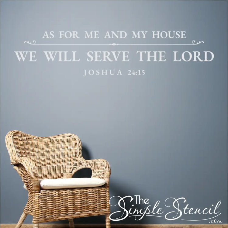 White vinyl Bible verse decal of Joshua 24:15 applied to a slate blue wall, positioned above a wicker armchair.