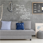 Beach inspired quote applied to a nautical themed room by The Simple Stencil reads: May you always have shells in your pockets and sand between your toes.